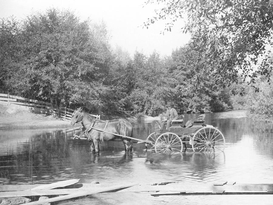 wagon crossing stream